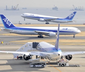 All Nippon Airways jetliner takes off from Tokyo's Haneda airport on January 29, 2010. AFP PHOTO